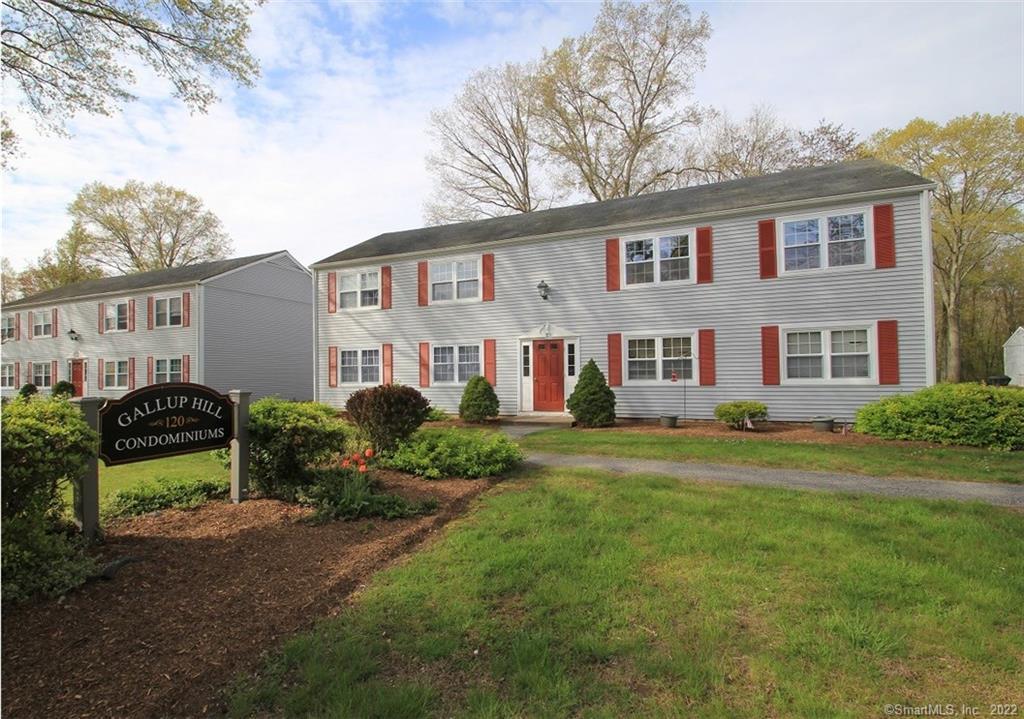 120 Gallup Hill Road, Unit 6C Ledyard, CT 06339 - Photo 1 of 1 a front view of a house with a yard