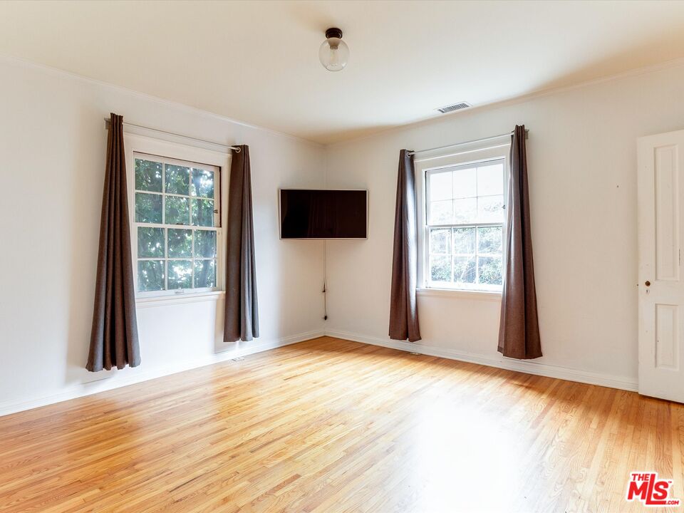 11729 Tennessee Avenue Los Angeles, CA 90064 - Photo 11 of 15 a view of an empty room with a window