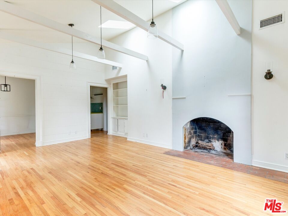 11729 Tennessee Avenue Los Angeles, CA 90064 - Photo 3 of 15 a view of empty room with wooden floor