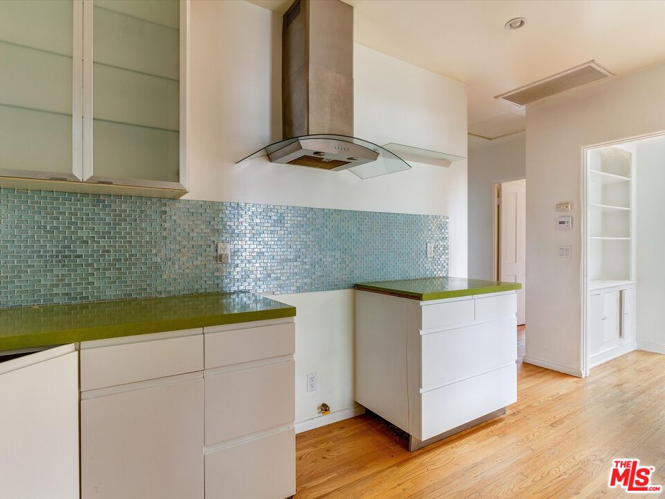 11729 Tennessee Avenue Los Angeles, CA 90064 - Photo 6 of 15 a kitchen with stainless steel appliances granite countertop a sink and a stove