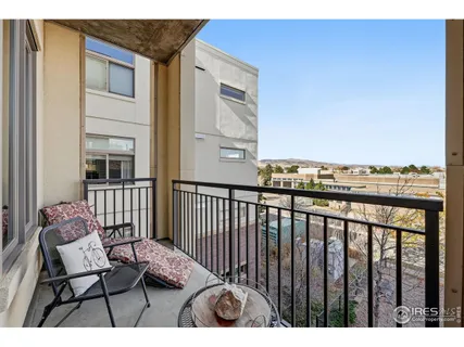 a kitchen with a table chairs a sink dishwasher window and cabinets