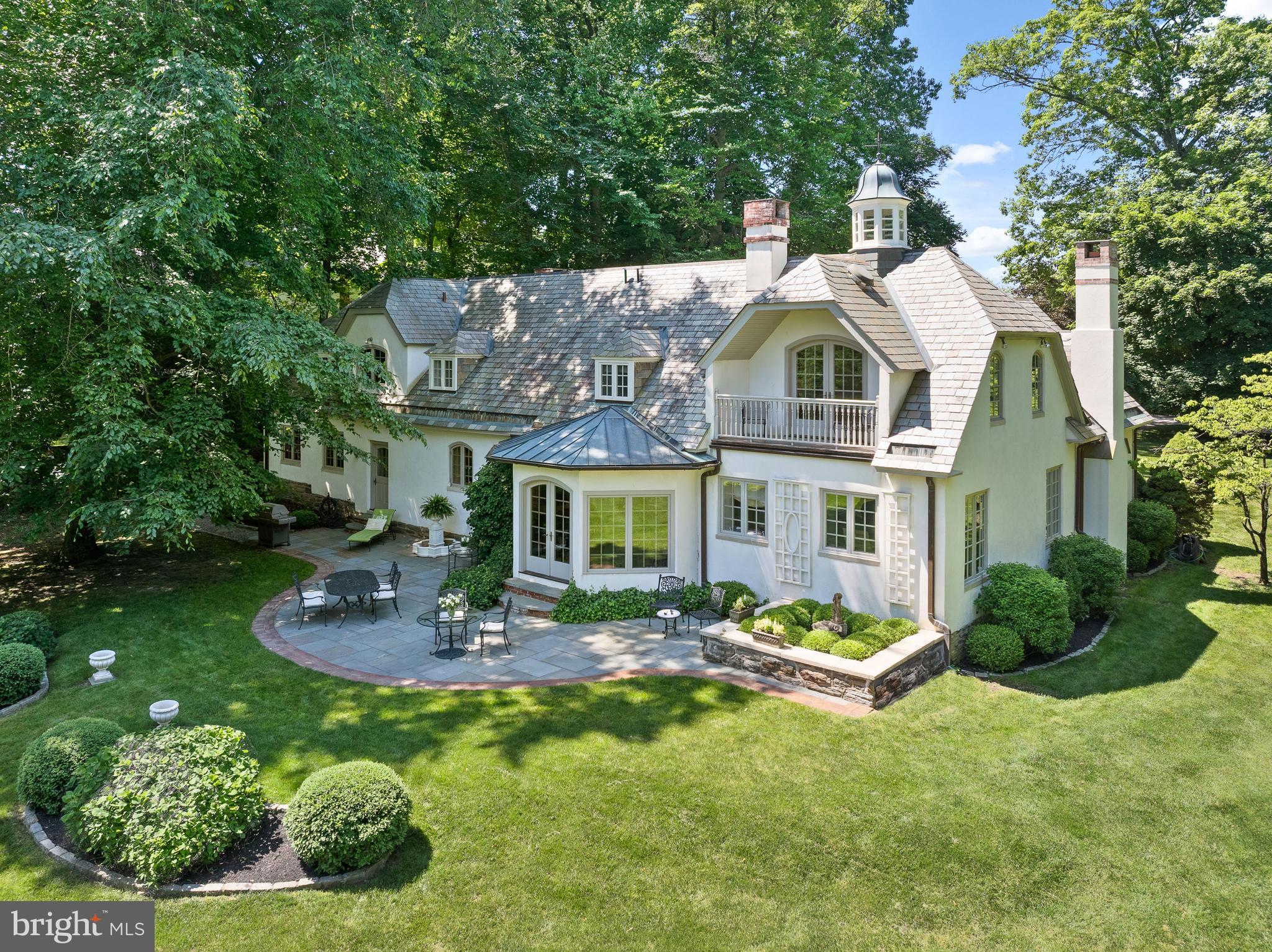 599 Longchamps Drive Wayne, PA 19087 - Photo 1 of 35 a front view of a house with garden