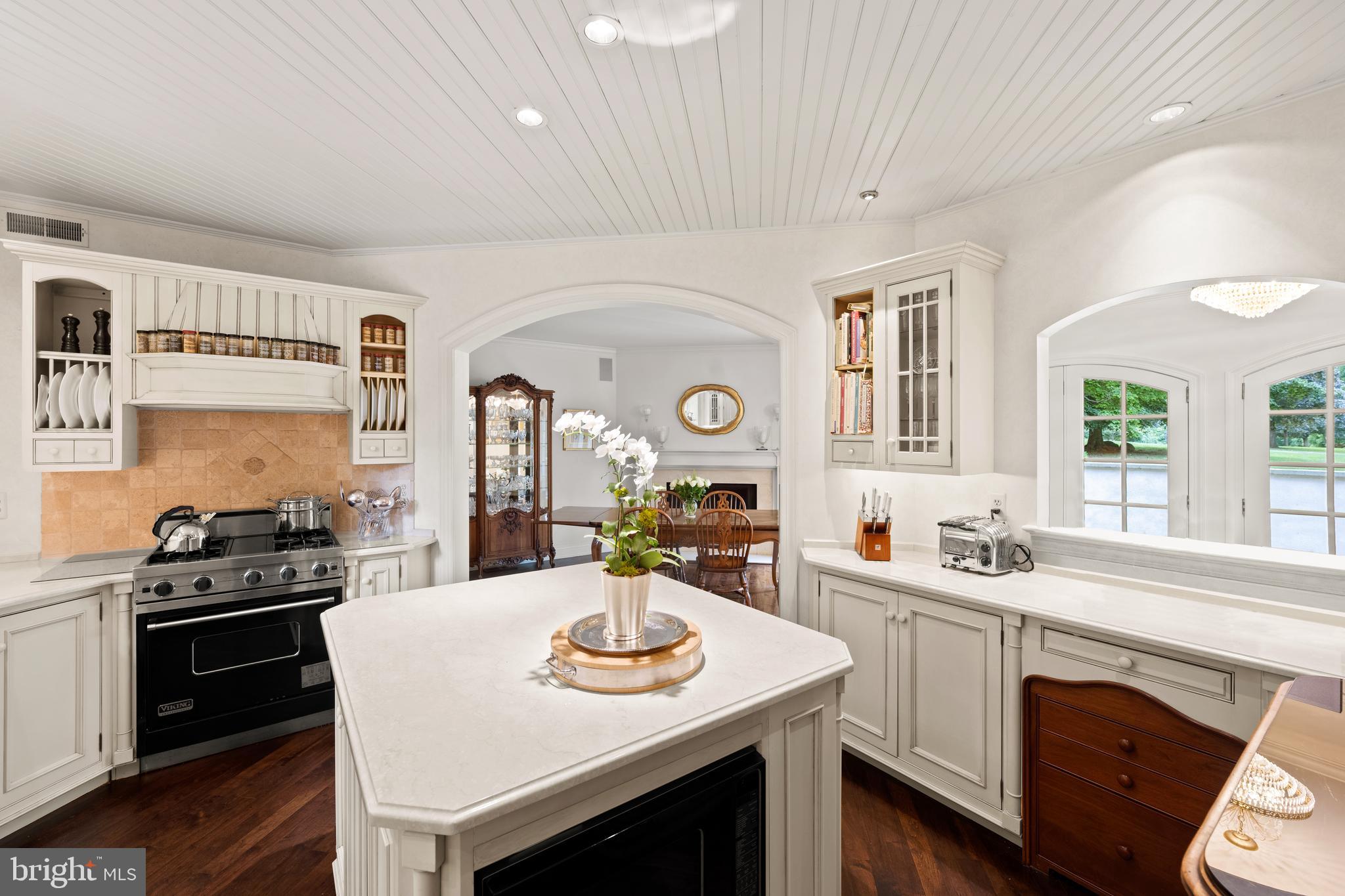 599 Longchamps Drive Wayne, PA 19087 - Photo 14 of 35 a kitchen with a sink stove and cabinets