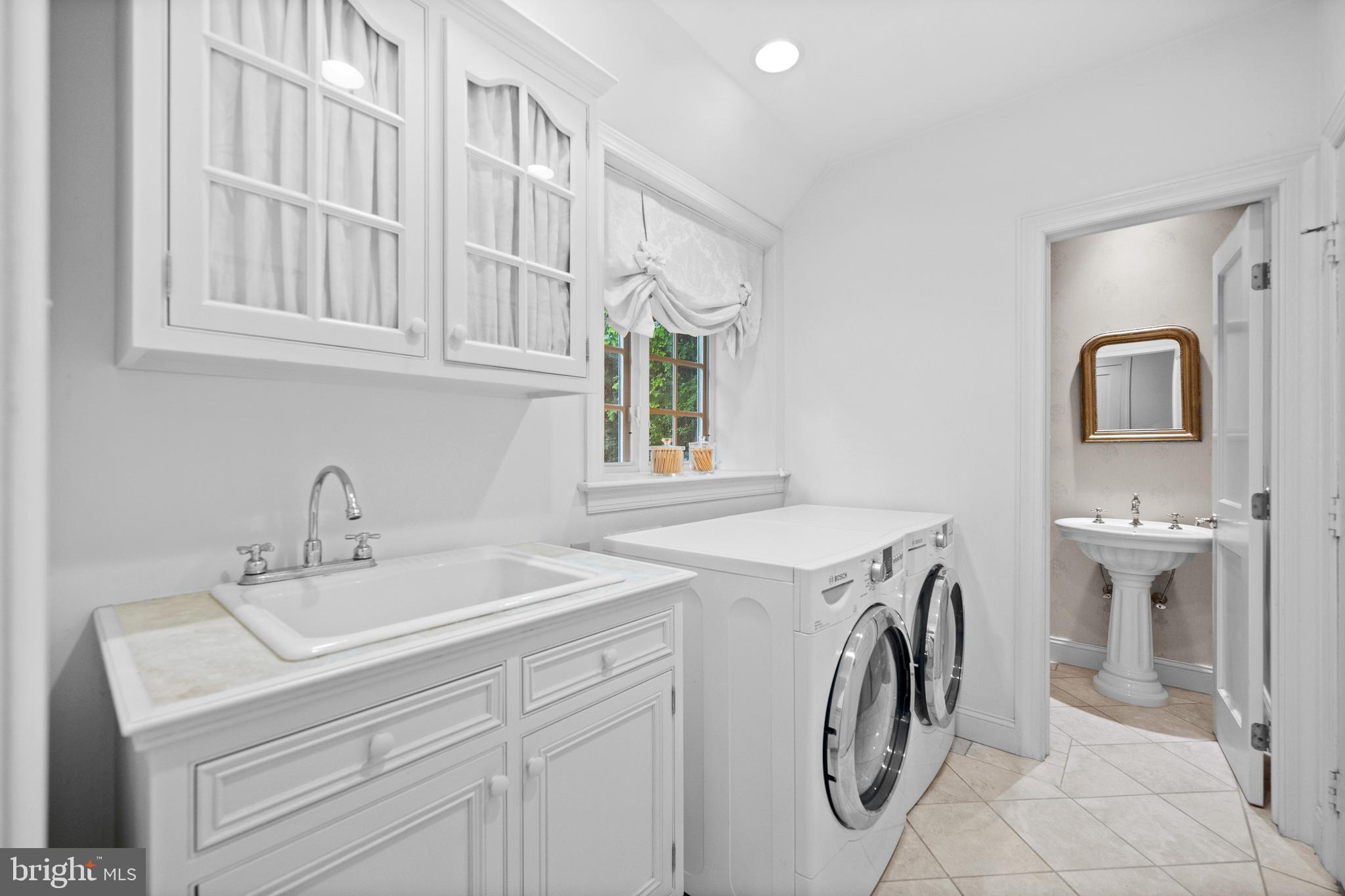 599 Longchamps Drive Wayne, PA 19087 - Photo 19 of 35 a utility room with dryer and washer