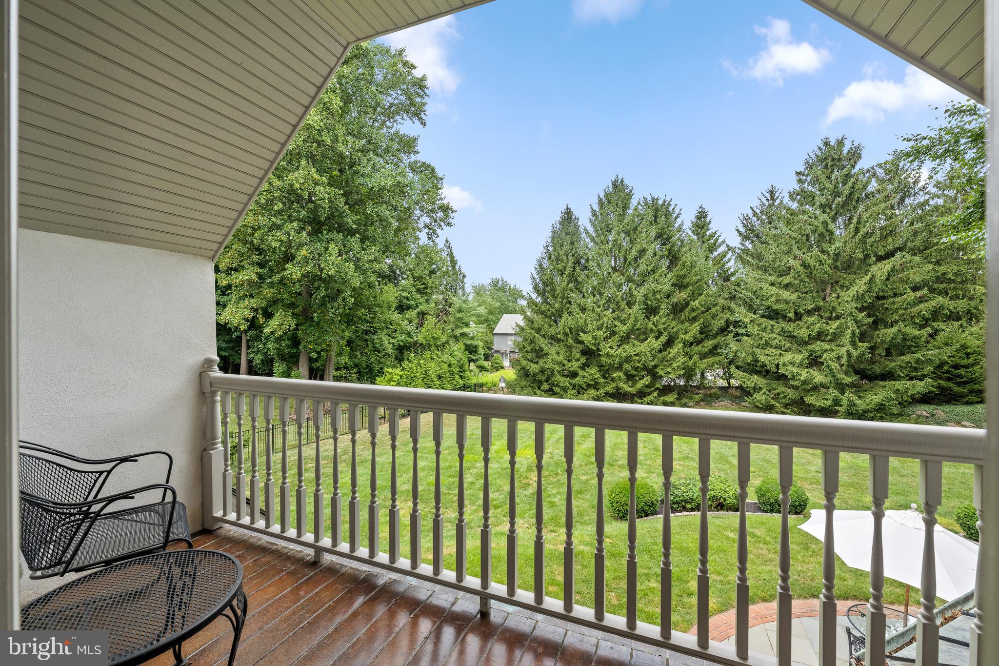 599 Longchamps Drive Wayne, PA 19087 - Photo 23 of 35 a balcony with trees in front of it