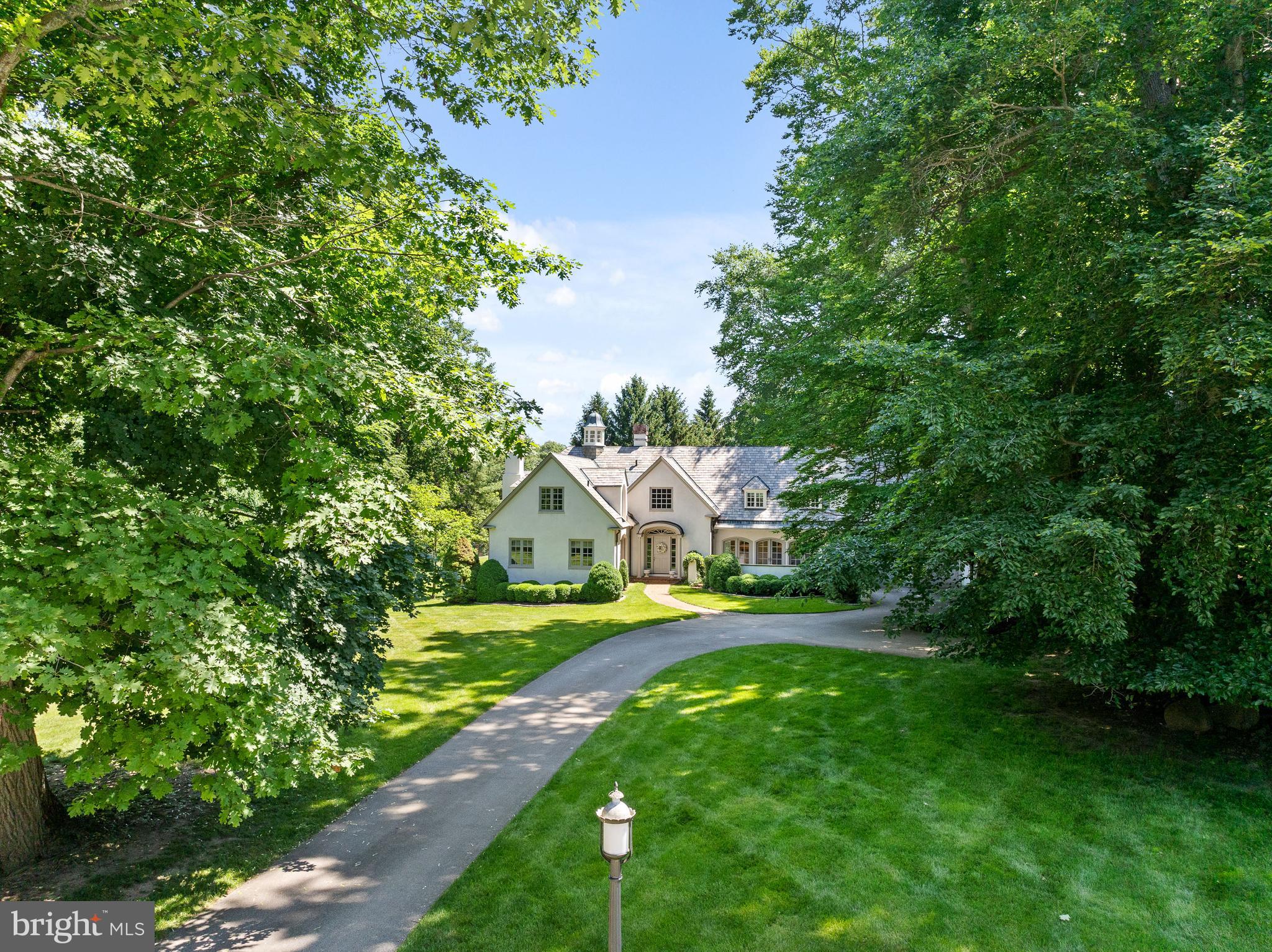 599 Longchamps Drive Wayne, PA 19087 - Photo 3 of 35 a view of an house with garden space and a yard