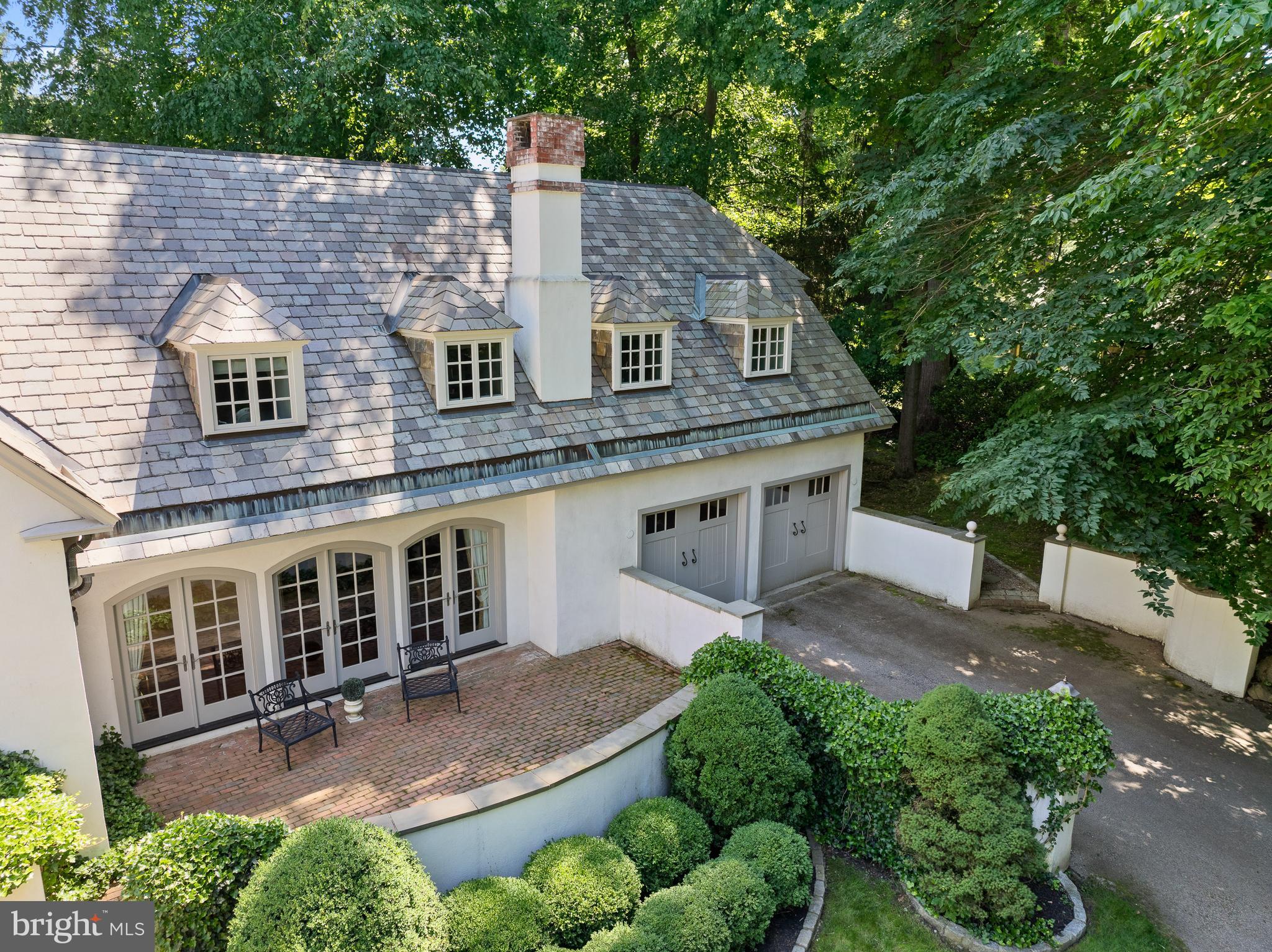599 Longchamps Drive Wayne, PA 19087 - Photo 4 of 35 a aerial view of a house with a yard and potted plants