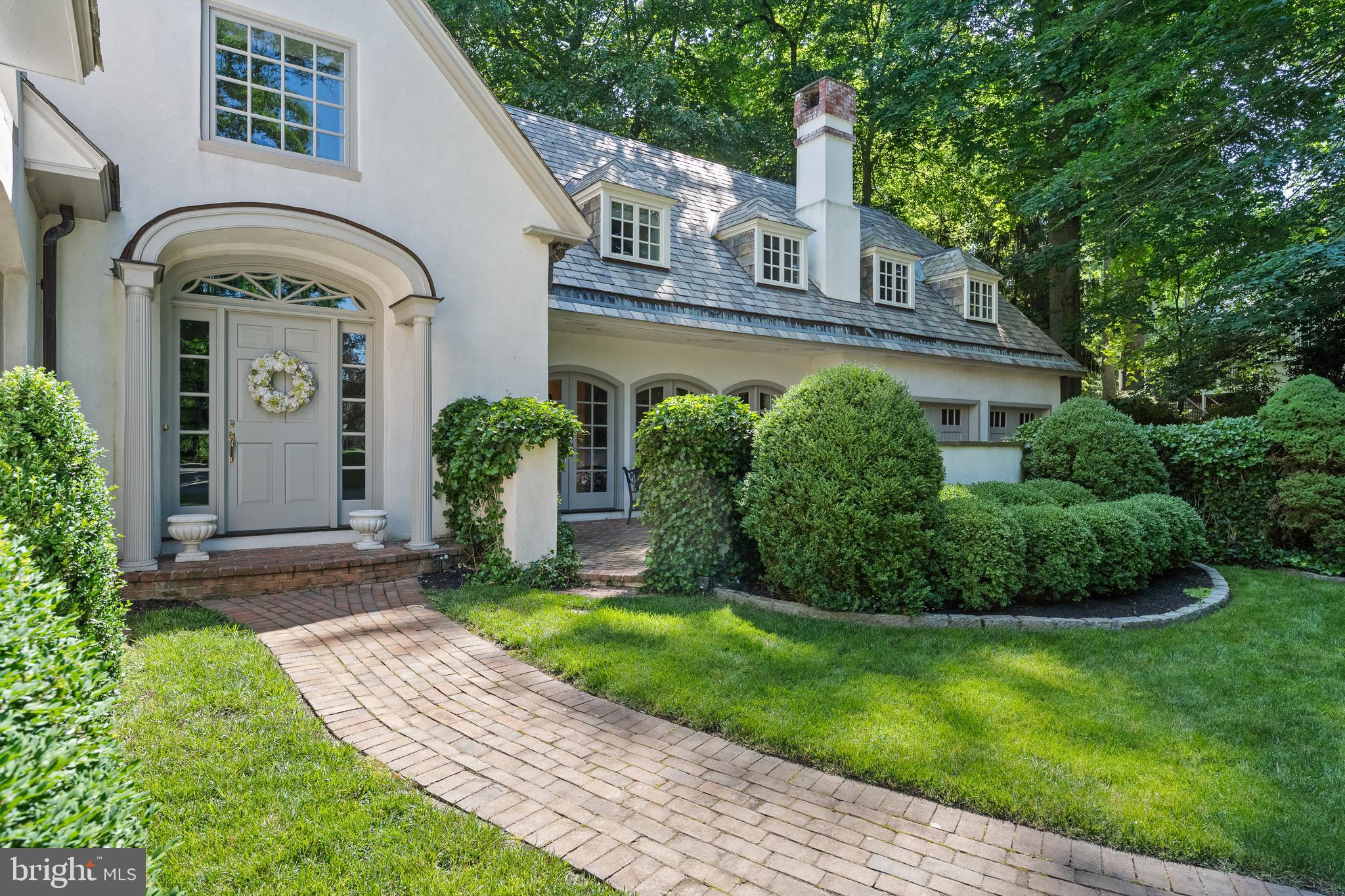 599 Longchamps Drive Wayne, PA 19087 - Photo 6 of 35 a front view of a house with garden