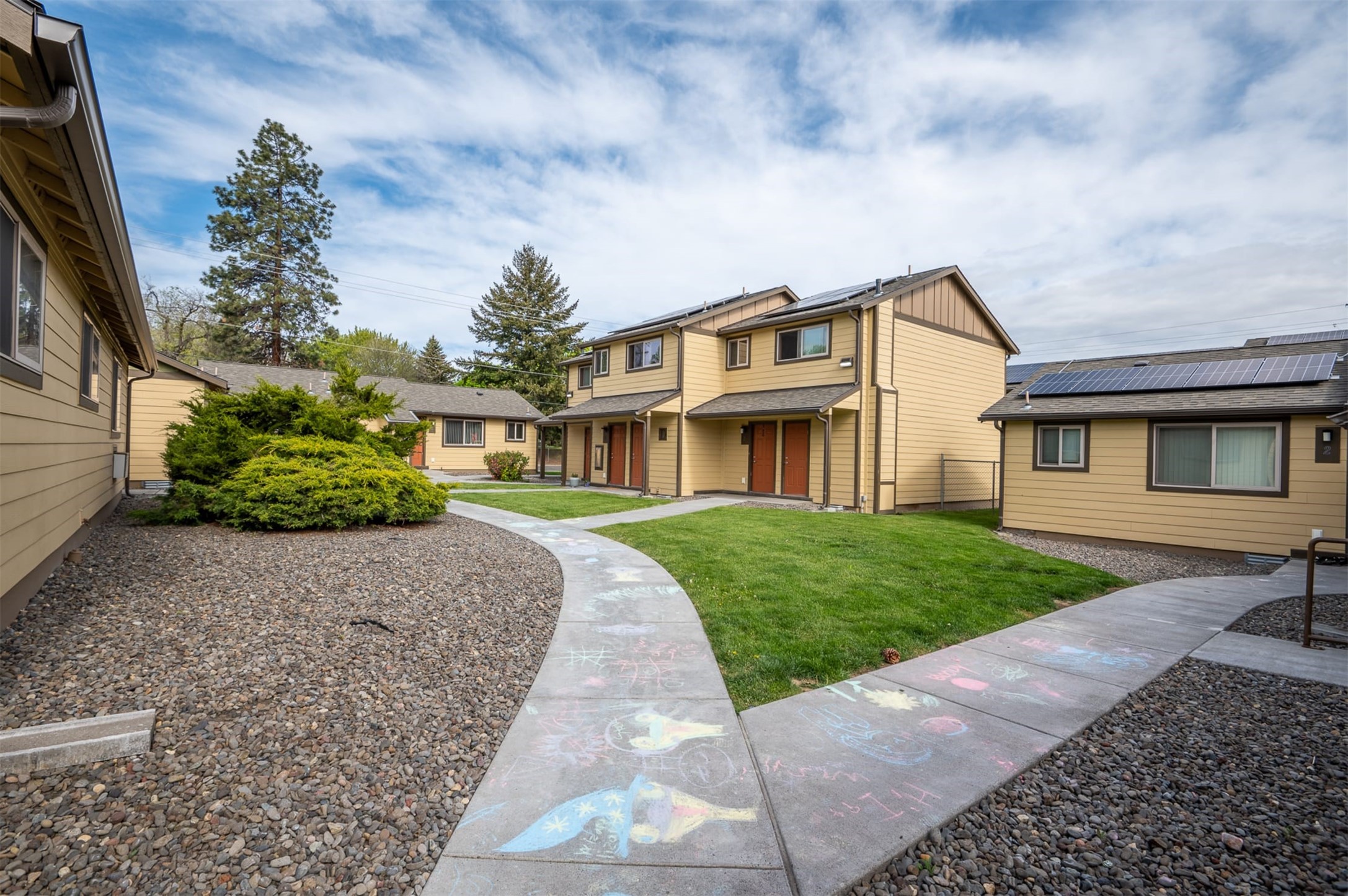 703 12th Street La Grande, OR 97850 - Photo 4 of 8 a front view of a house with a garden and trees