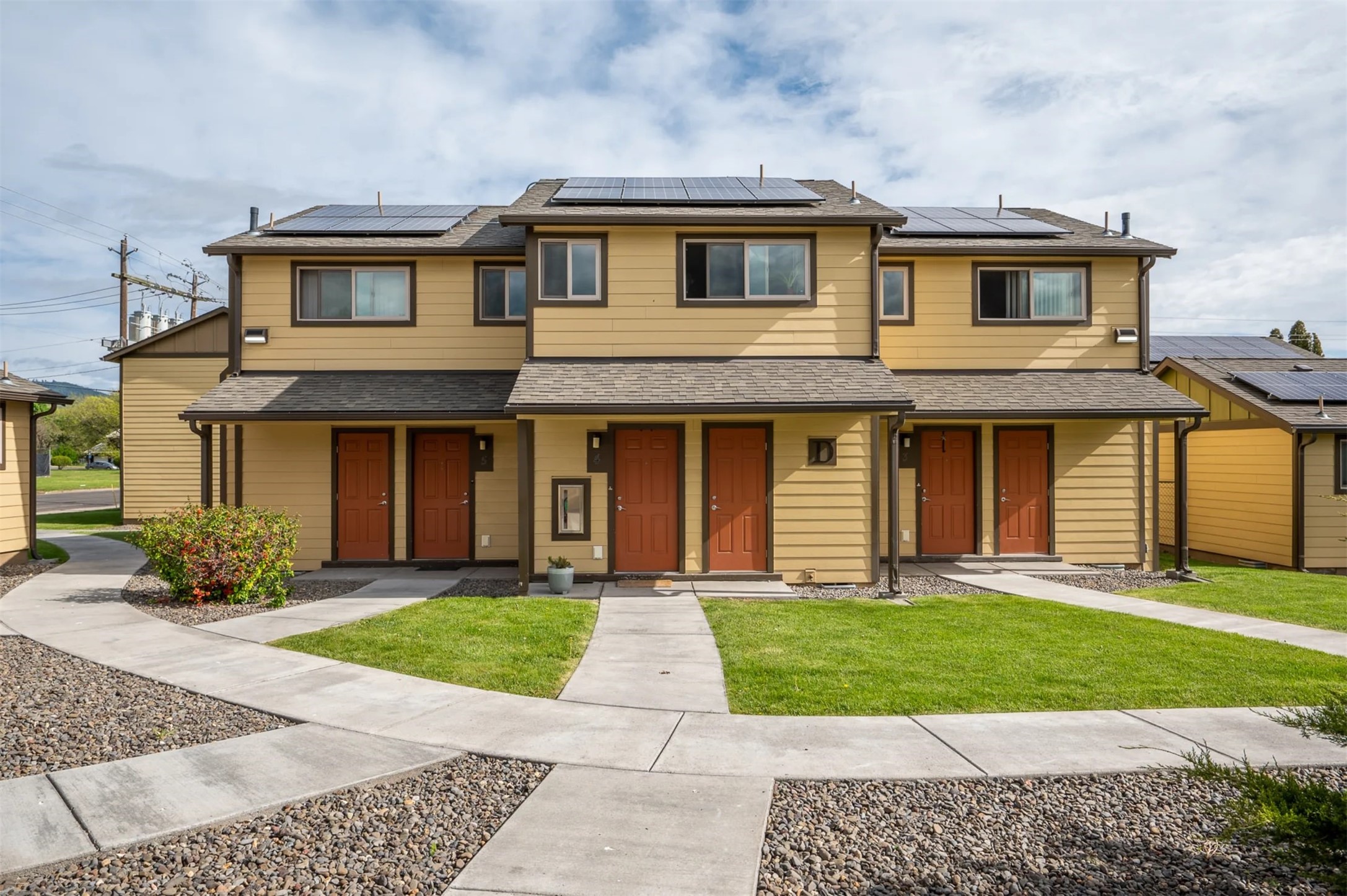 703 12th Street La Grande, OR 97850 - Photo 5 of 8 a front view of a house with a yard and trees