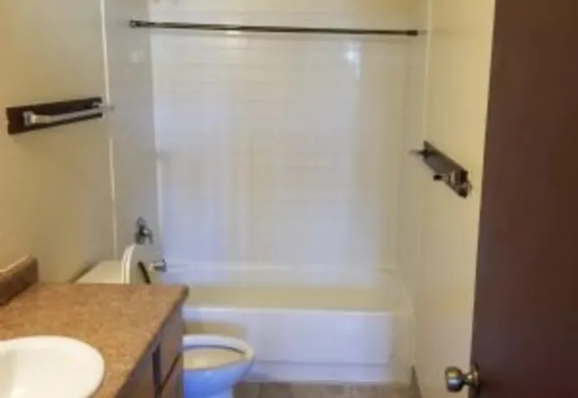 a kitchen with a stove and a sink