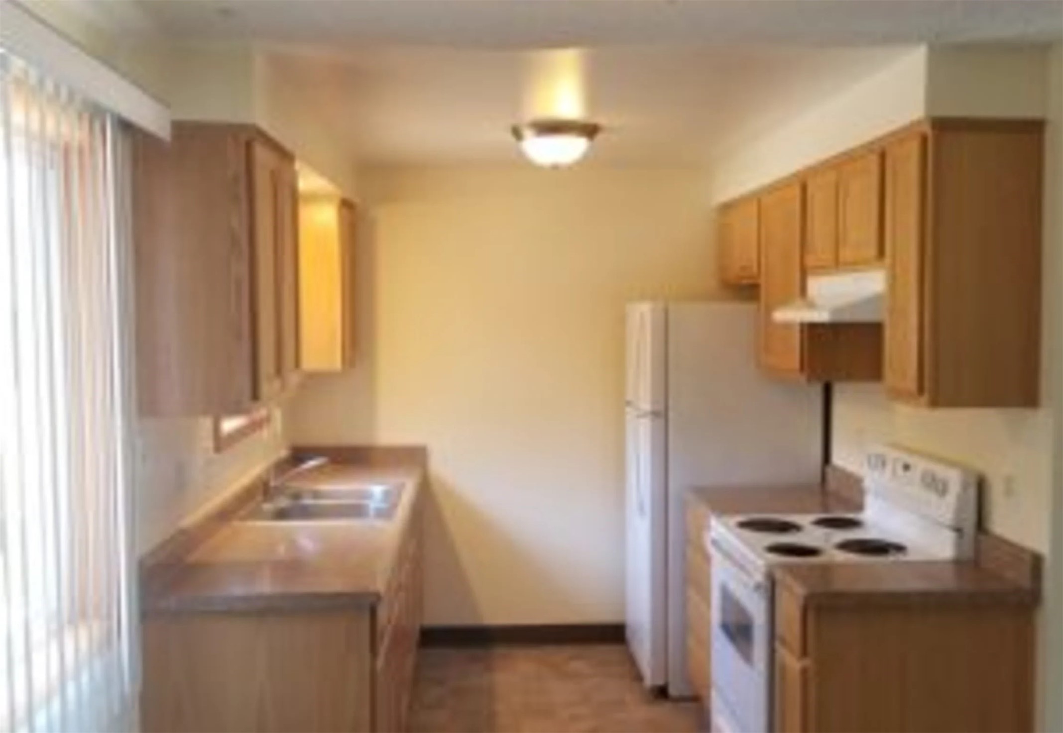 703 12th Street La Grande, OR 97850 - Photo 8 of 8 a kitchen with a stove and a sink