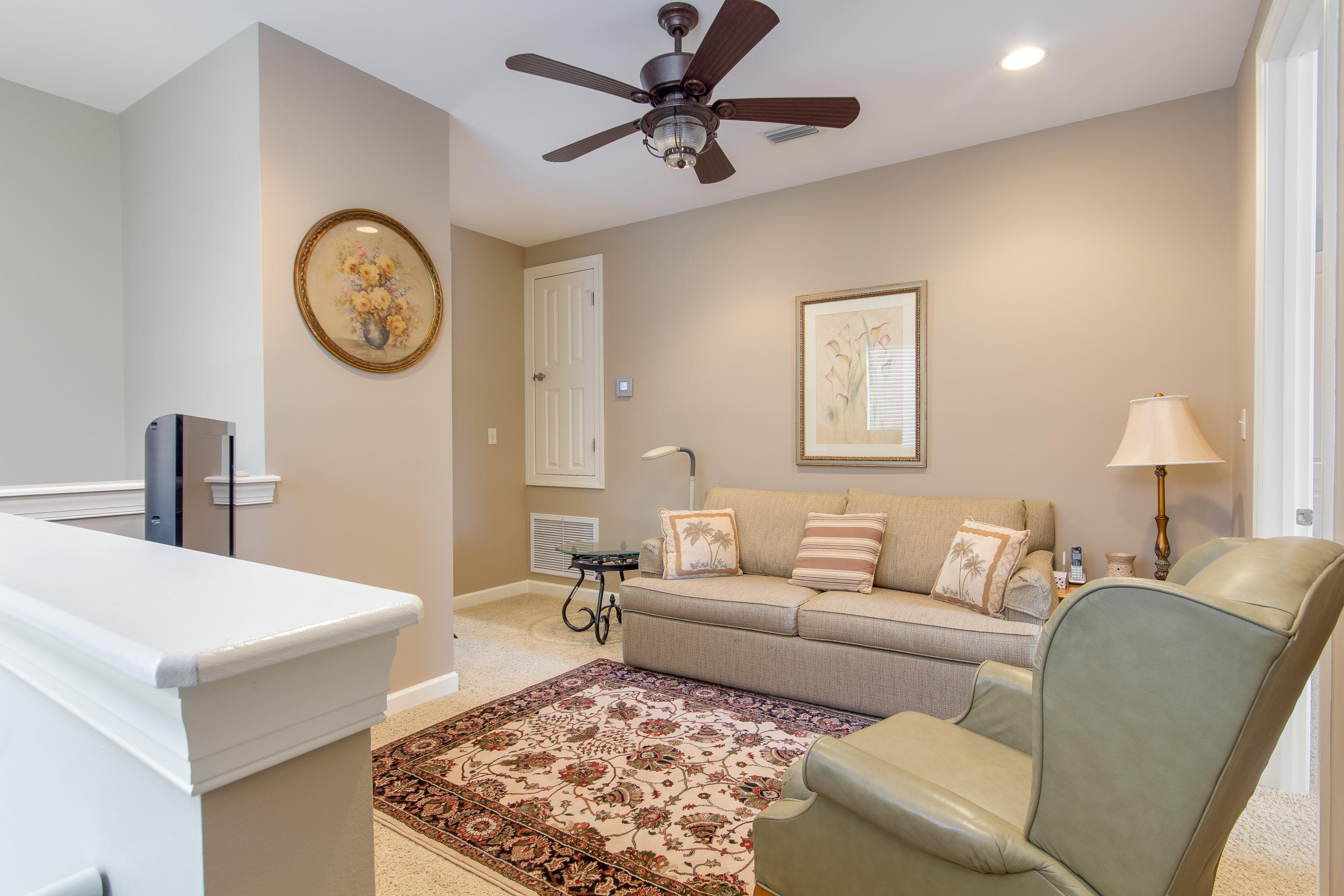 240 South Zander Way Santa Rosa Beach, FL 32459 - Photo 12 of 19 a living room with furniture a clock and a ceiling fan