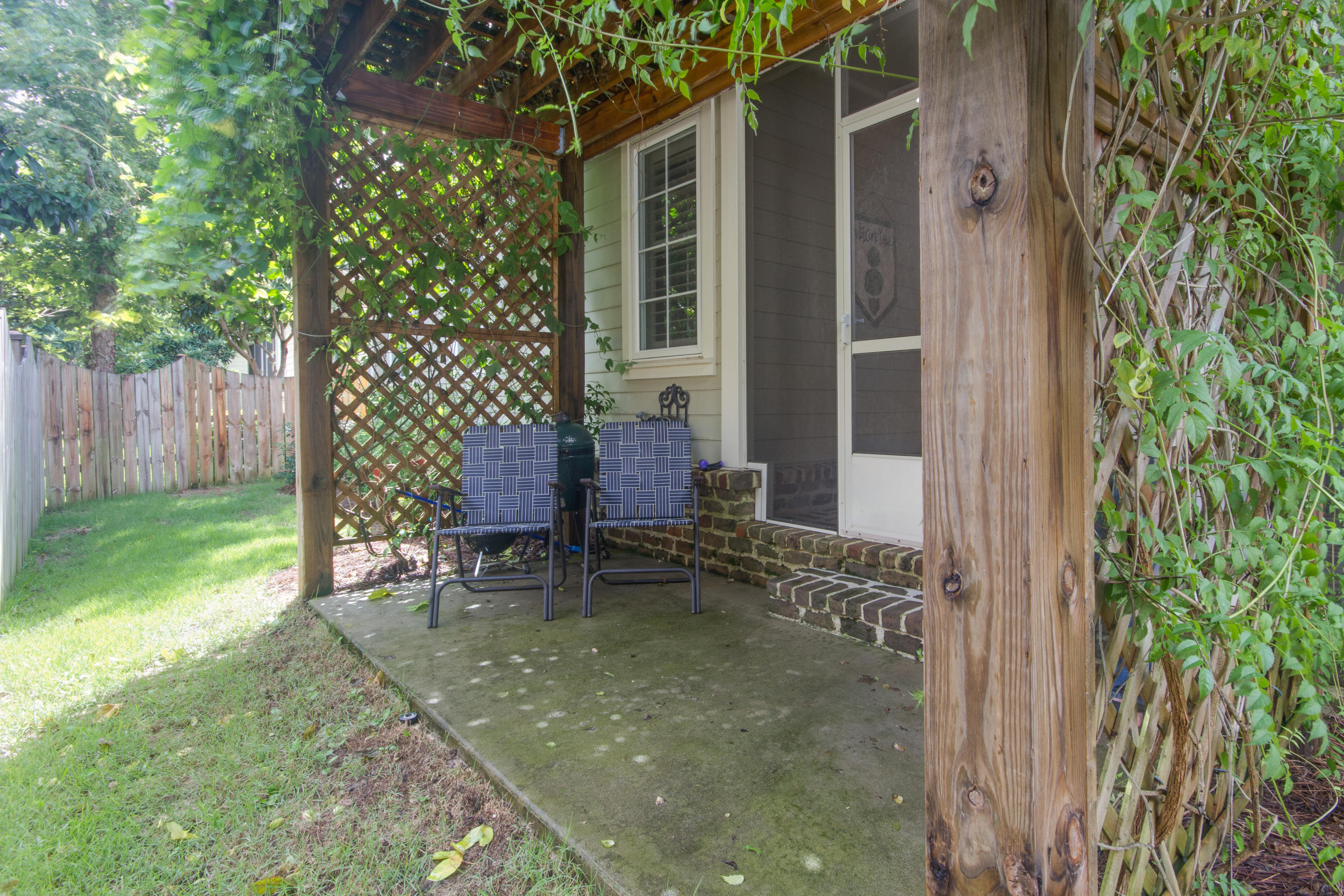 240 South Zander Way Santa Rosa Beach, FL 32459 - Photo 18 of 19 a backyard of a house with chairs and table