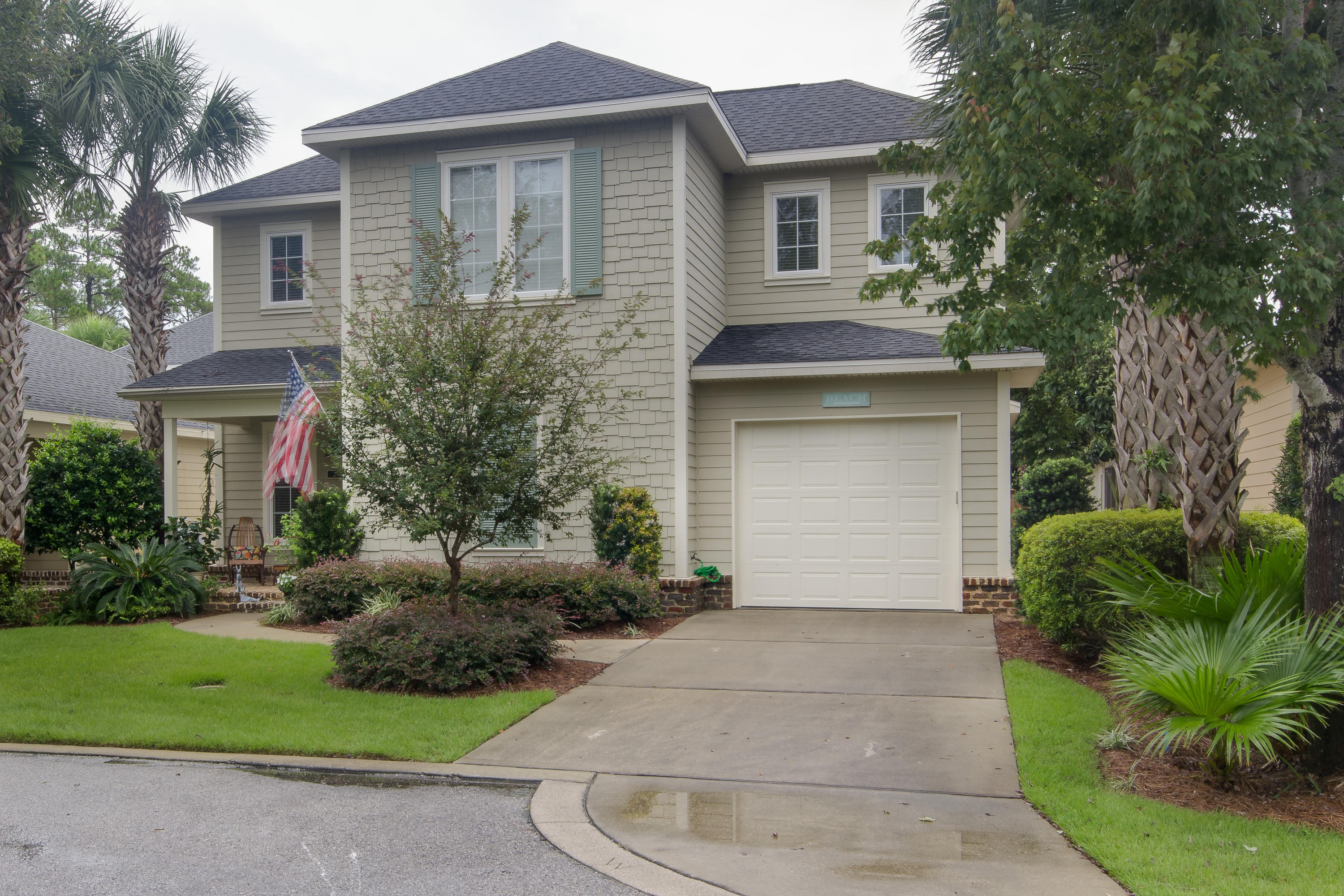 240 South Zander Way Santa Rosa Beach, FL 32459 - Photo 19 of 19 a front view of a house with a garden and plants