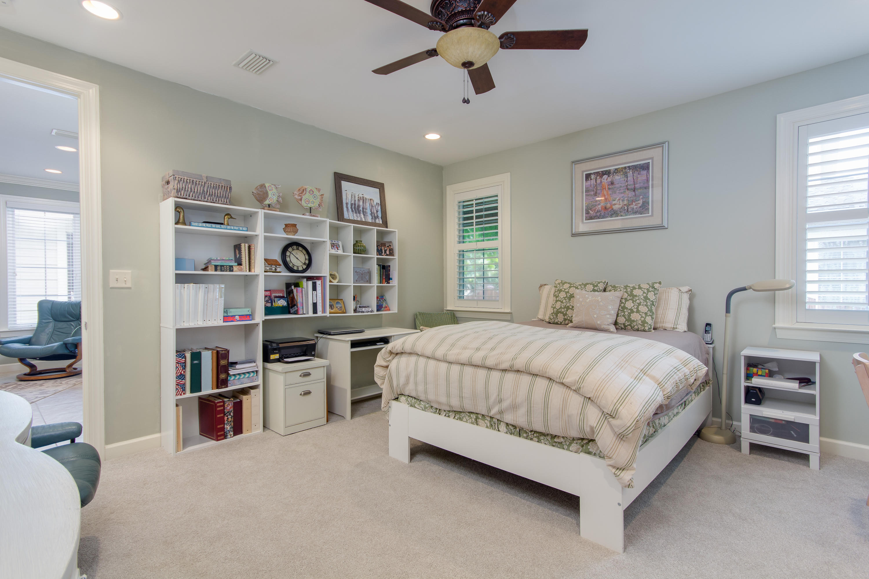 240 South Zander Way Santa Rosa Beach, FL 32459 - Photo 9 of 19 a spacious bedroom with a bed and a bookshelf