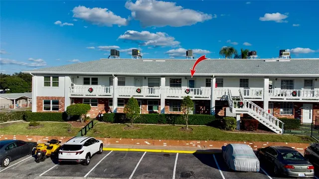 a view of yard with swimming pool and furniture