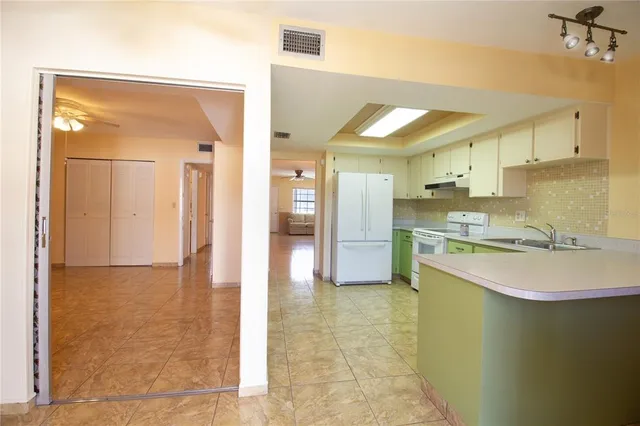 a bathroom with a sink a mirror and a shower