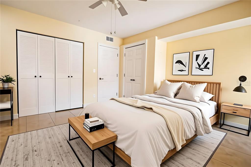 4742 Azalea Drive, Unit 203 New Port Richey, FL 34652 - Photo 17 of 32 a bedroom with a bed and a dresser