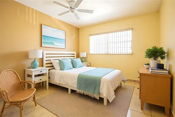 a bedroom with a bed chair and roof