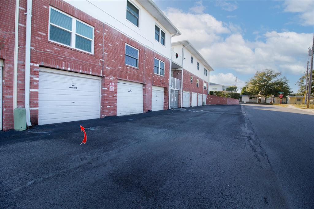 4742 Azalea Drive, Unit 203 New Port Richey, FL 34652 - Photo 23 of 32 a sign board with buildings in the background