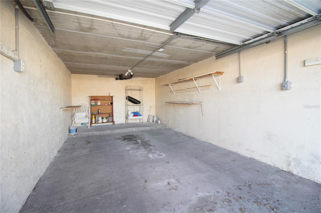 4742 Azalea Drive, Unit 203 New Port Richey, FL 34652 - Photo 24 of 32 a view of a garage