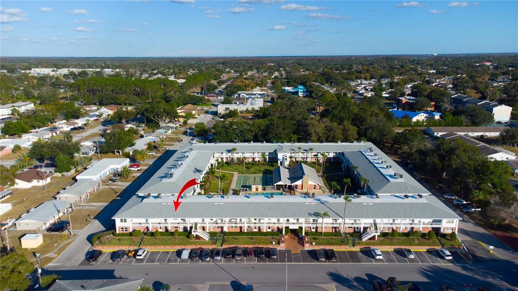 4742 Azalea Drive, Unit 203 New Port Richey, FL 34652 - Photo 25 of 32 a view of an outdoor space with seating area