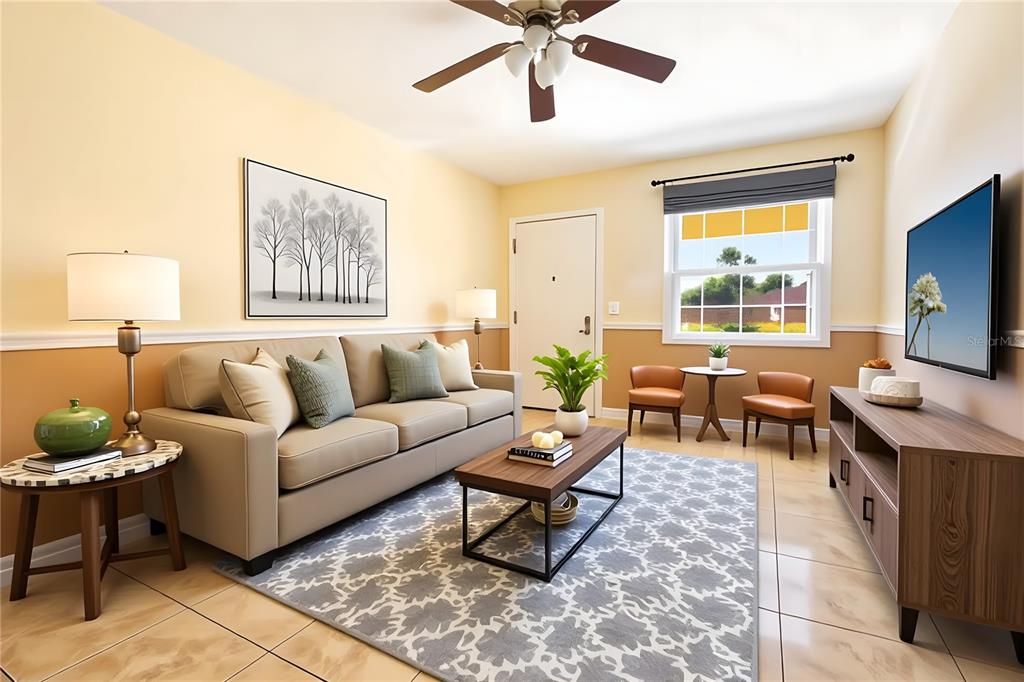 4742 Azalea Drive, Unit 203 New Port Richey, FL 34652 - Photo 3 of 32 a living room with furniture and a flat screen tv