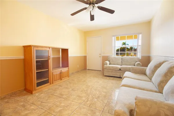 a living room with furniture and windows