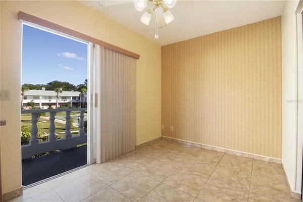 a view of an empty room with a window
