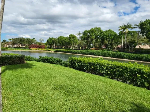 a view of a lake with a big yard