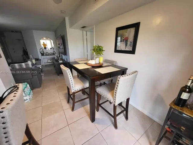 a kitchen with a refrigerator a stove a microwave and cabinets