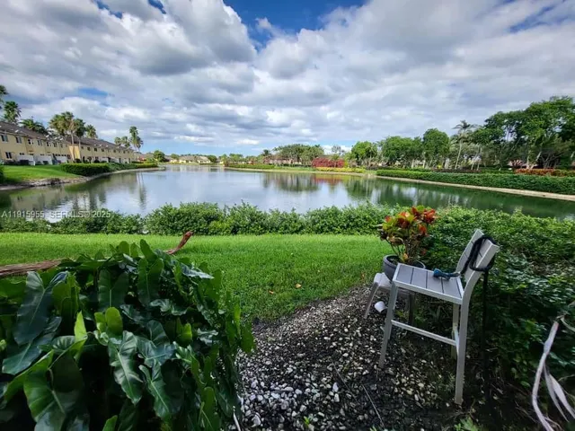 a view of a livingroom with an empty space and a kitchen space