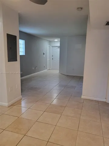 a kitchen with stainless steel appliances a refrigerator sink and microwave