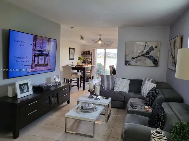 a bedroom with a bed and a tv