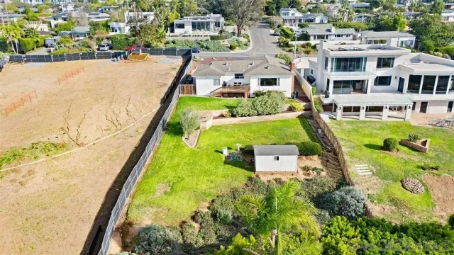 an aerial view of a house with a swimming pool