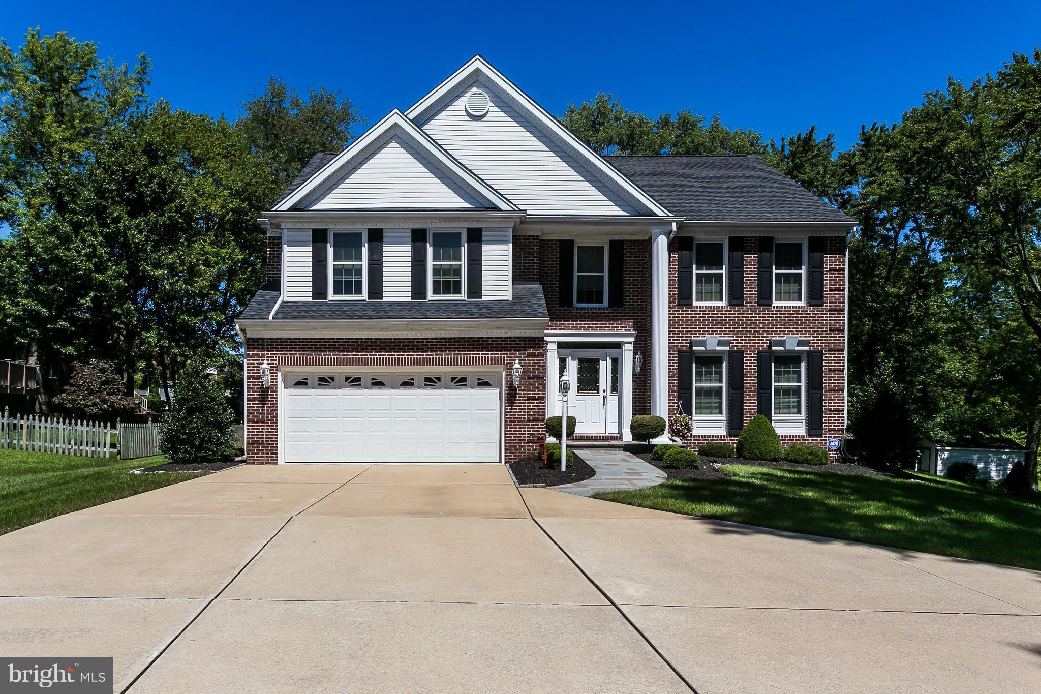 a front view of a house with yard