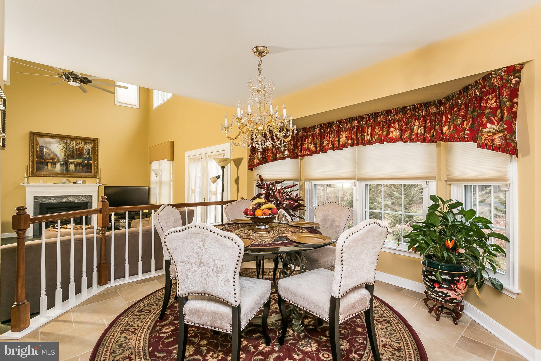 9111 Gardenia Road Baltimore, MD 21236 - Photo 13 of 30 a dining room with furniture a chandelier and wooden floor