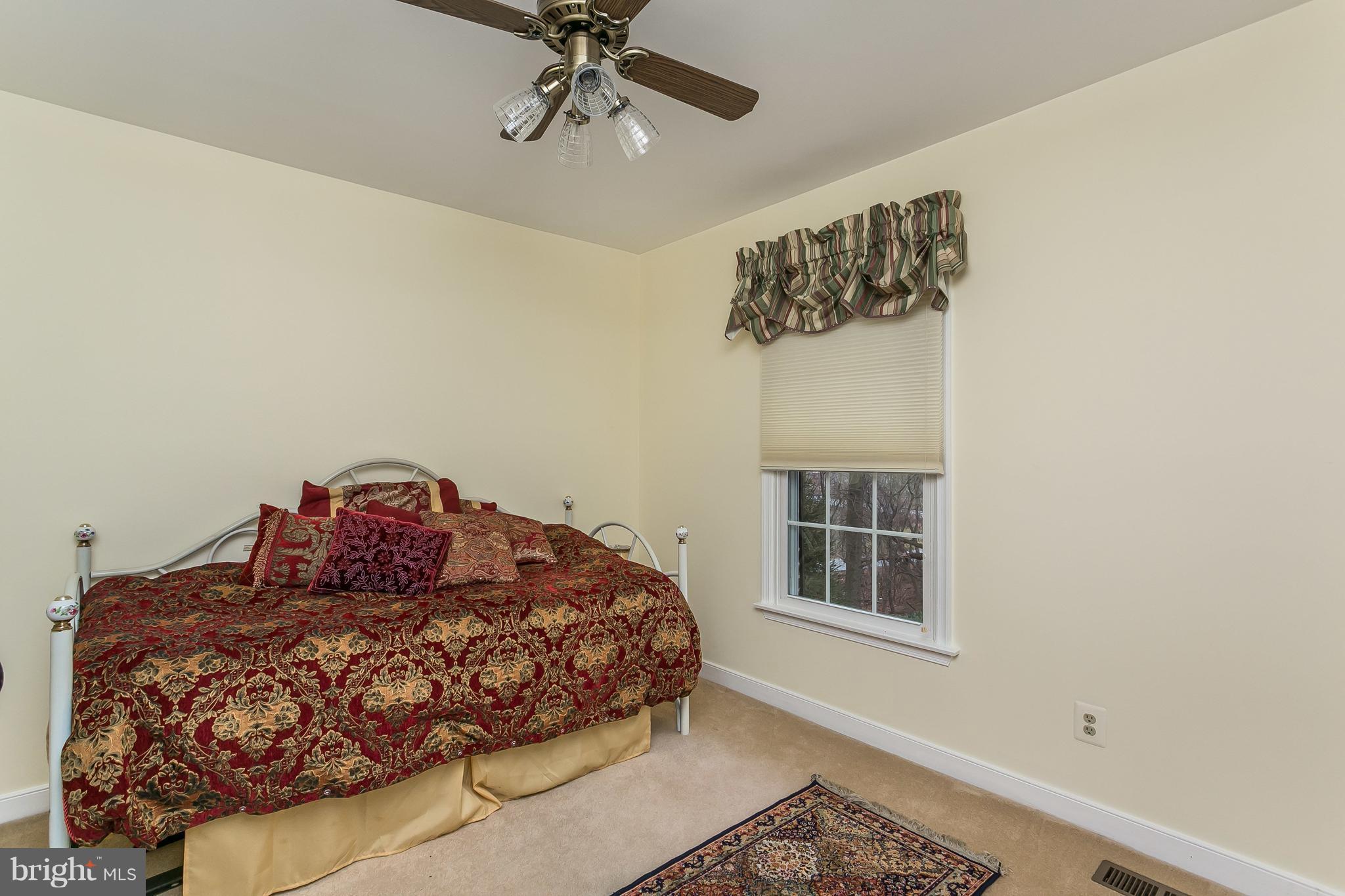 9111 Gardenia Road Baltimore, MD 21236 - Photo 20 of 30 a bedroom with a bed and a window