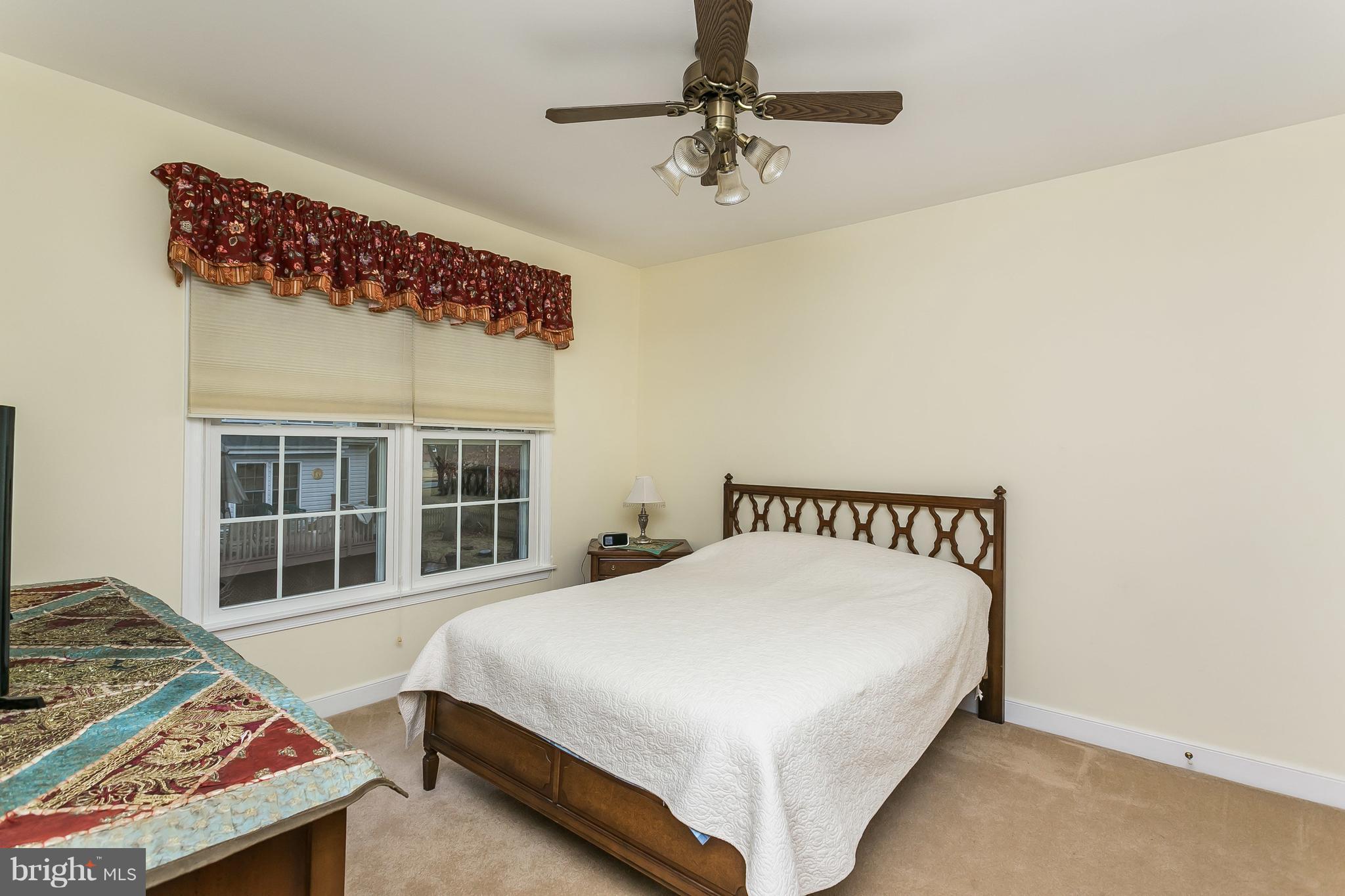 9111 Gardenia Road Baltimore, MD 21236 - Photo 22 of 30 a bedroom with a bed and a window