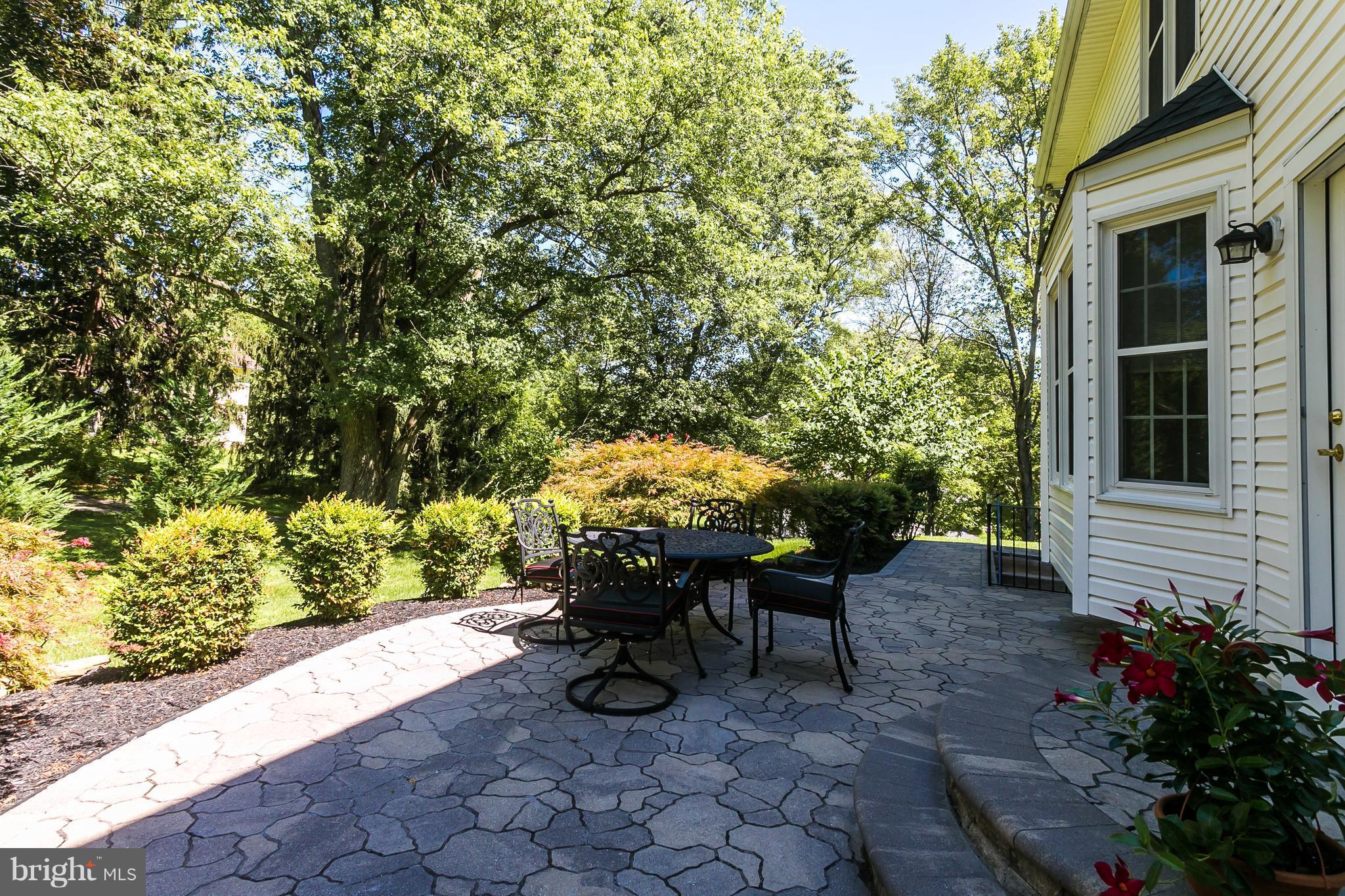 9111 Gardenia Road Baltimore, MD 21236 - Photo 28 of 30 a view of a patio with table and chairs and potted plants