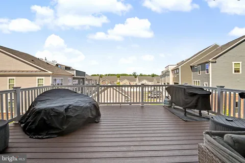 a view of a terrace with wooden floor and city view