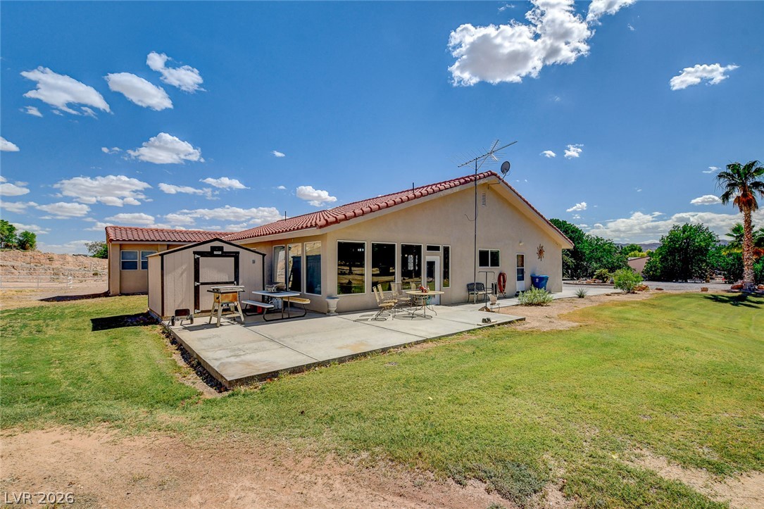 1950 Bowman Road Logandale, NV 89021 - Photo 59 of 81 A spacious backyard patio provides ample space for outdoor gatherings and relaxation.