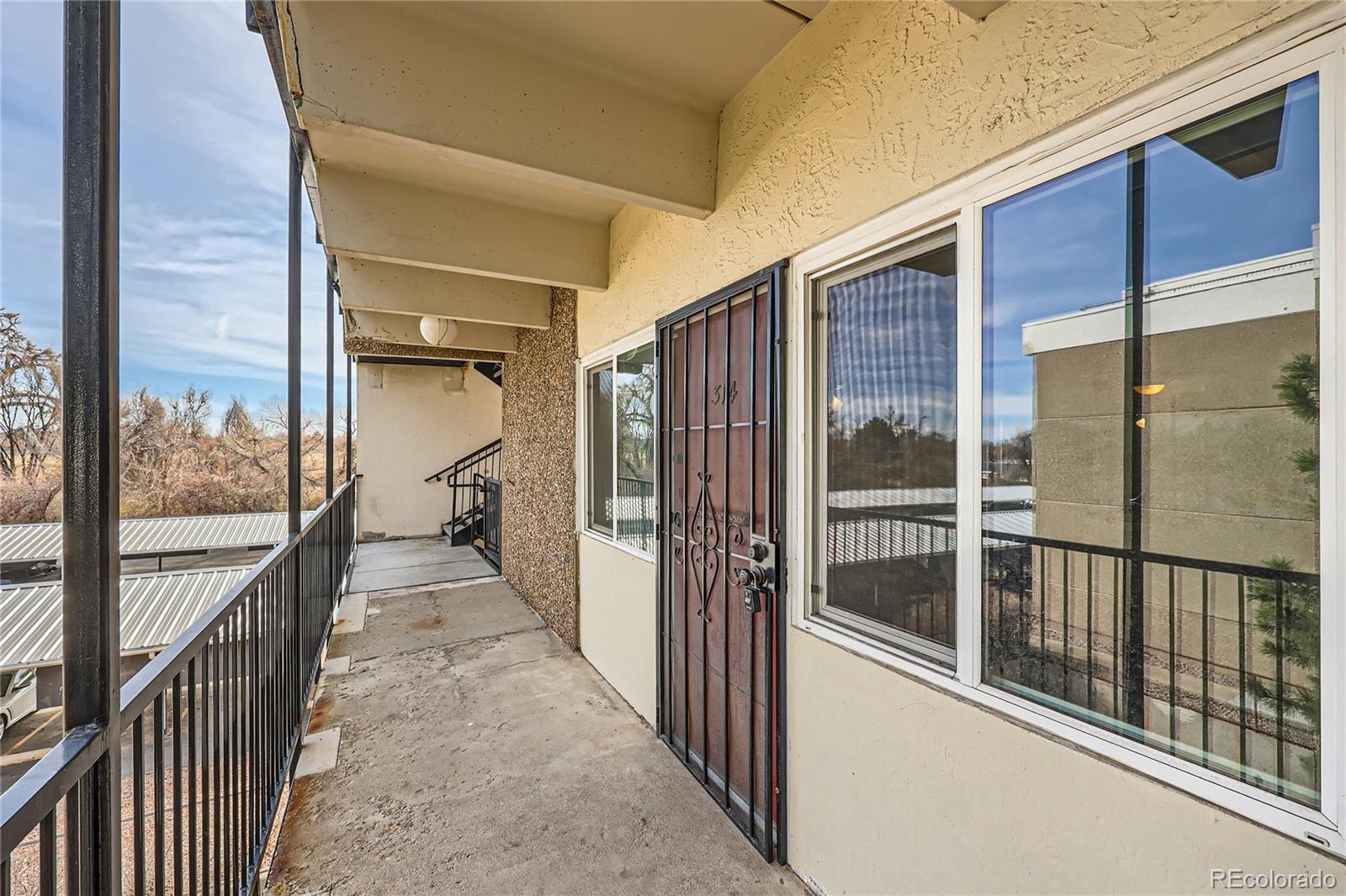 384 South Ironton Street, Unit 314 Aurora, CO 80012 - Photo 11 of 12 a view of a balcony