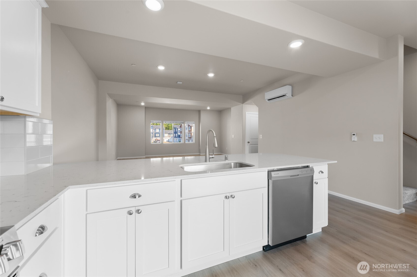 17417 118th Ave Court East, Unit E Puyallup, WA 98374 - Photo 12 of 31 a kitchen with white cabinets and sink