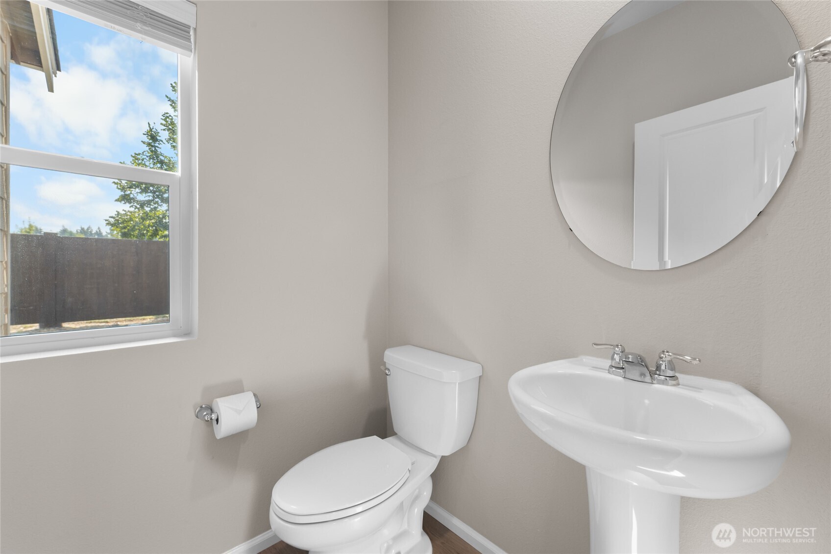 17417 118th Ave Court East, Unit E Puyallup, WA 98374 - Photo 14 of 31 a bathroom with a sink a toilet and a mirror