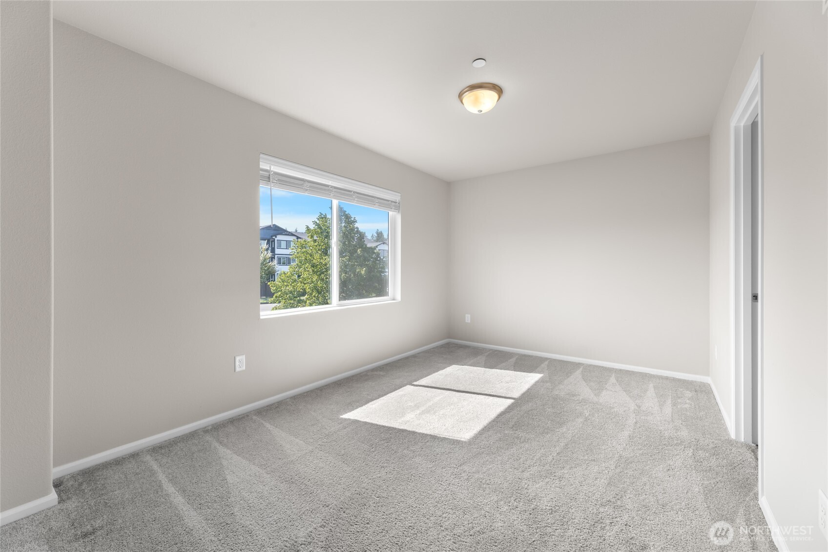 17417 118th Ave Court East, Unit E Puyallup, WA 98374 - Photo 23 of 31 an empty room with windows