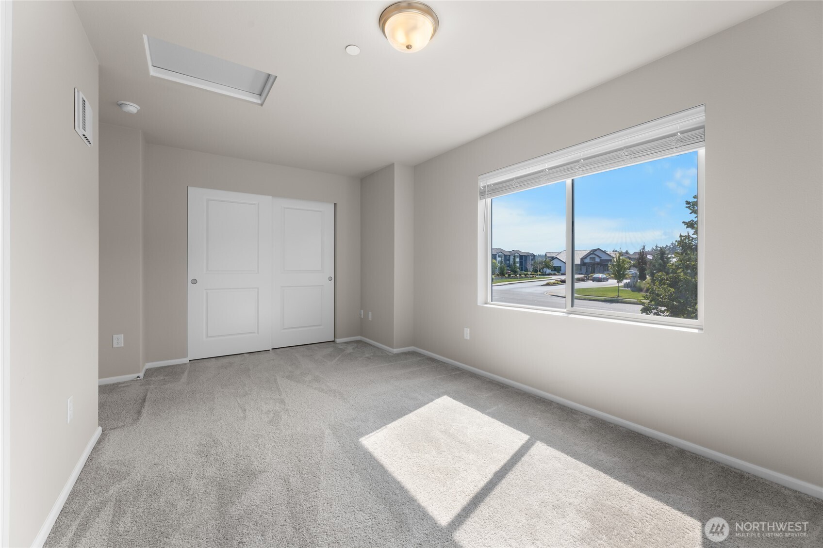 17417 118th Ave Court East, Unit E Puyallup, WA 98374 - Photo 25 of 31 a view of an empty room with a window