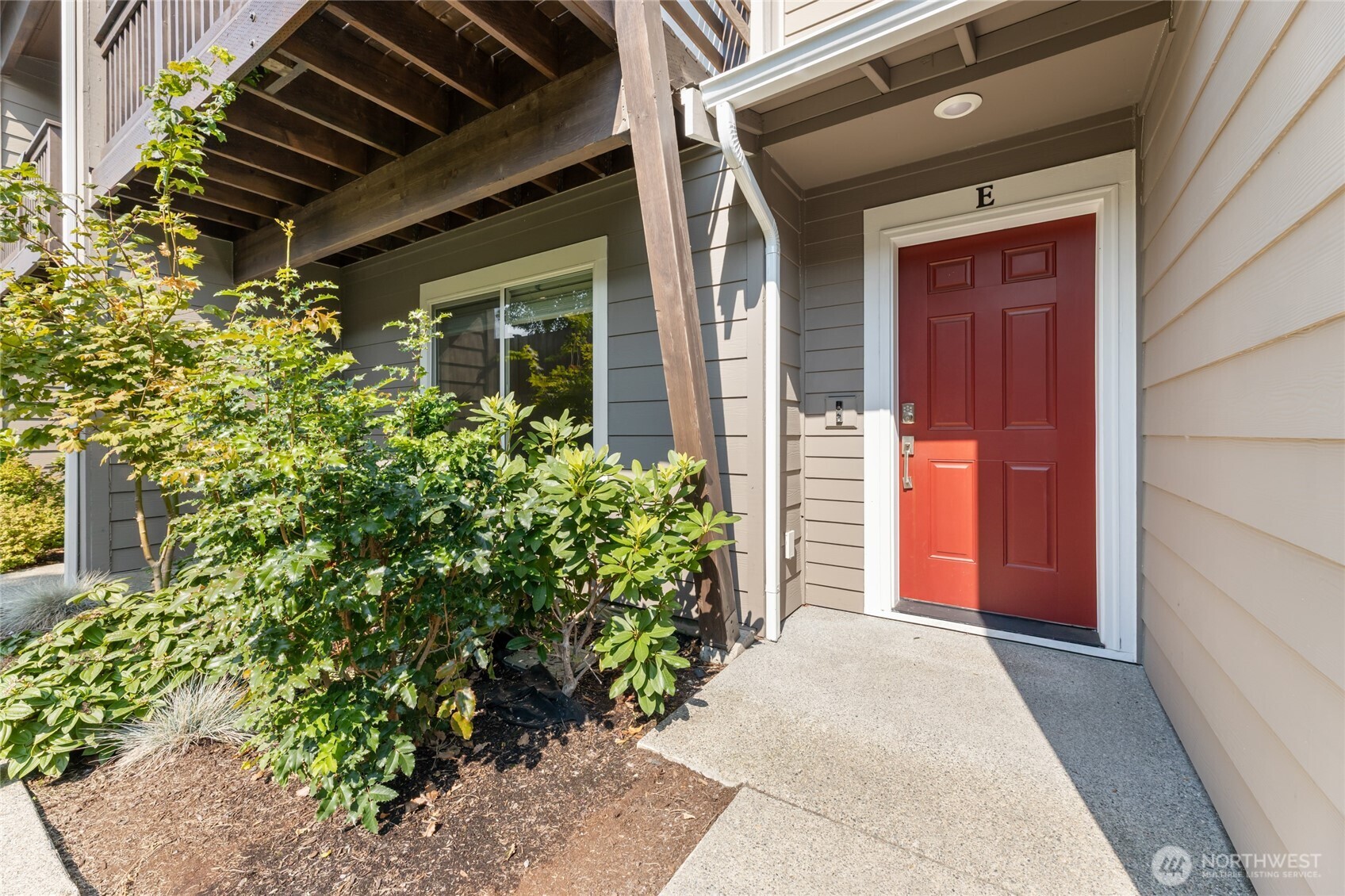 17417 118th Ave Court East, Unit E Puyallup, WA 98374 - Photo 28 of 31 a front view of a house with a garage