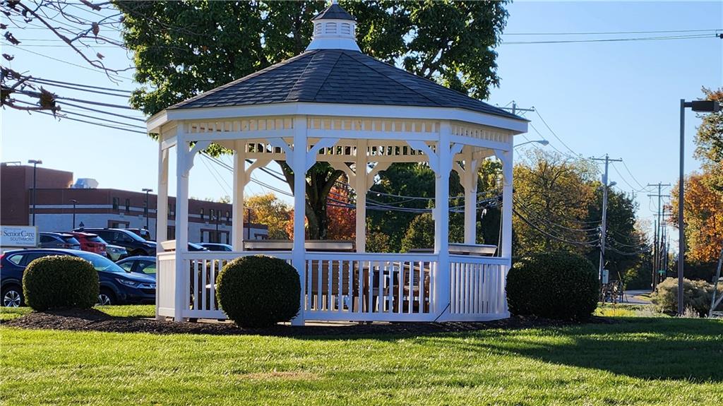 830 South Main Street, Unit 211 Washington, PA 15301 - Photo 17 of 17 a view of a deck that has a pathway sign and a yard
